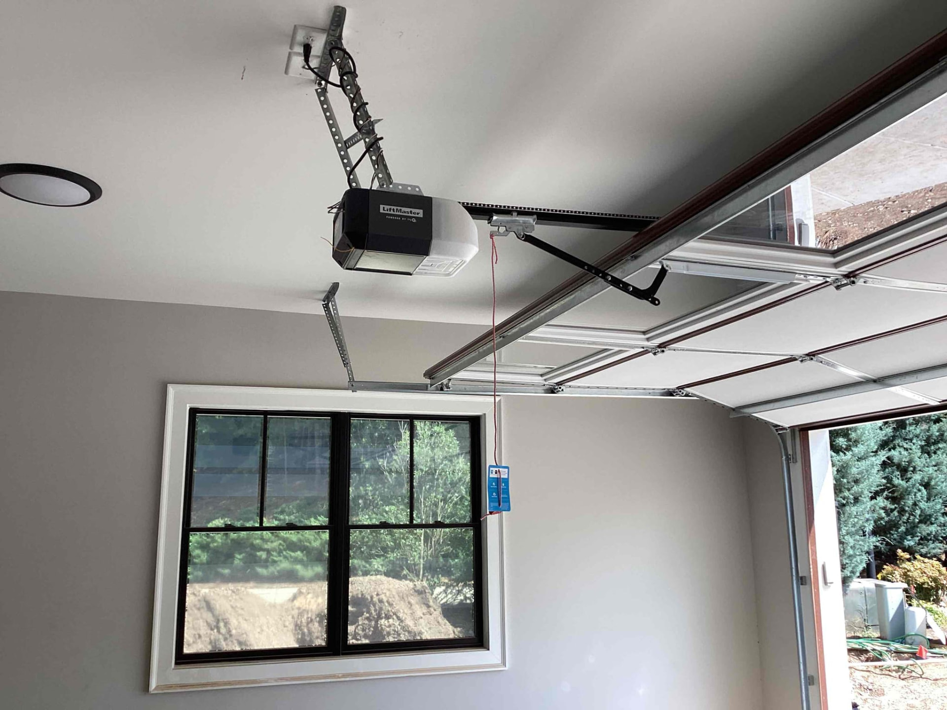 Garage interior with door tracks and overhead hardware